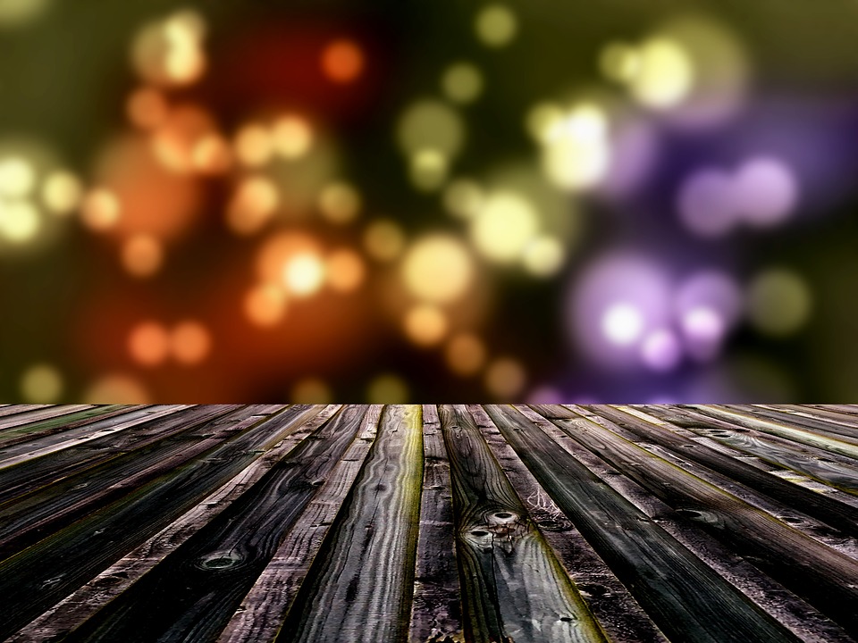 wooden decking with christmas lights in background