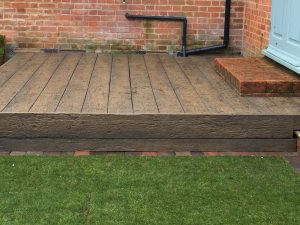 rustic thick wood decking in garden