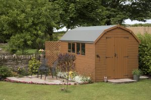 large garden shed with window and patio